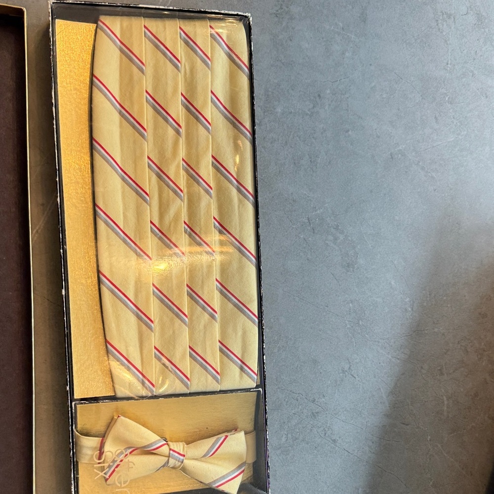 Yellow, red and grey striped cummerbund and bow tie